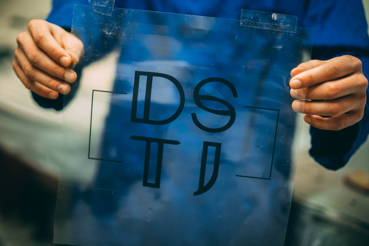 person holding DSTI plastic frame