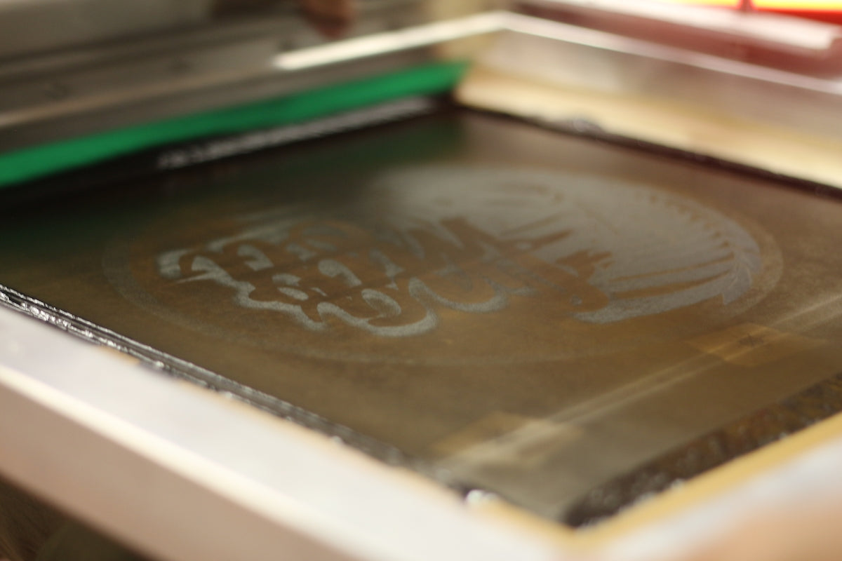 a close up of a metal object with writing on it