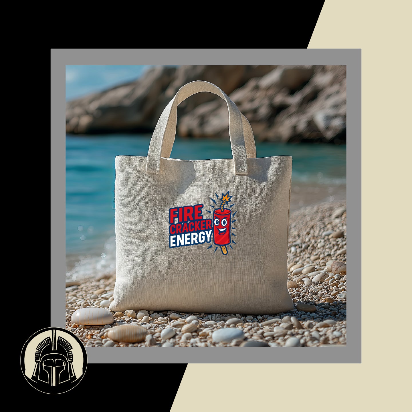 Beige tote bag with 'Firecracker Energy' design on a pebbly beach.