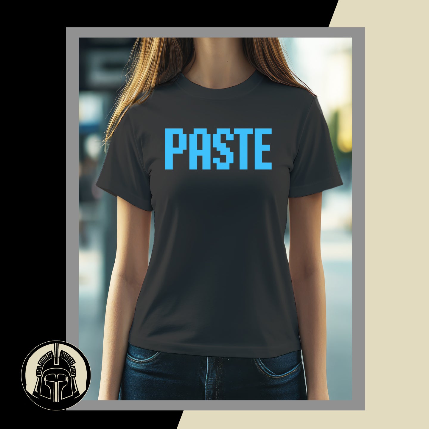 Person wearing a black t-shirt with 'PASTE' in blue letters, standing against a blurred background.
