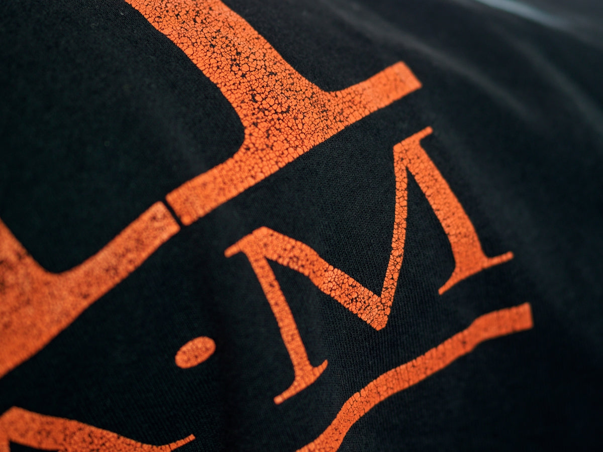 black and orange printed textile