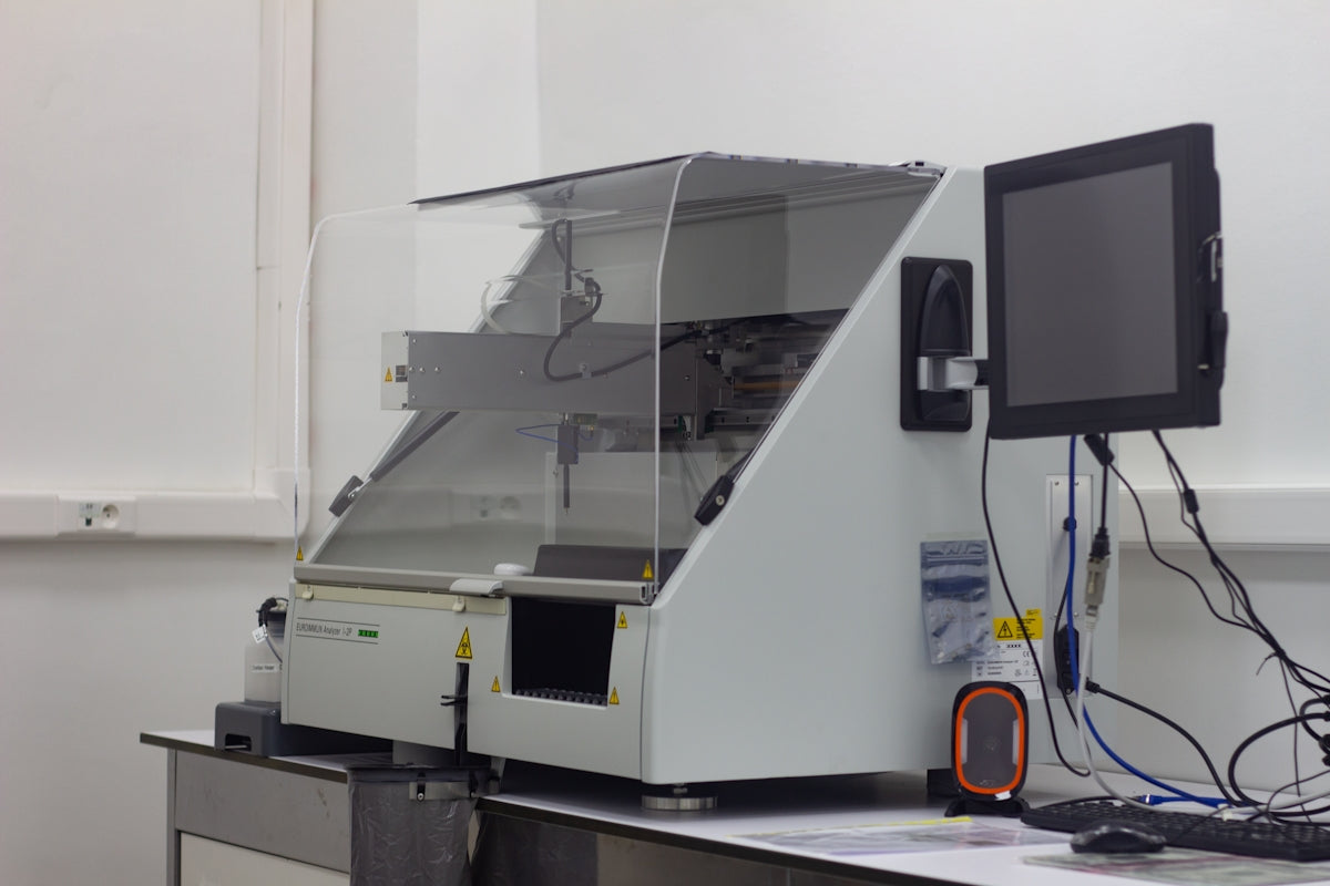 a large white machine with a monitor