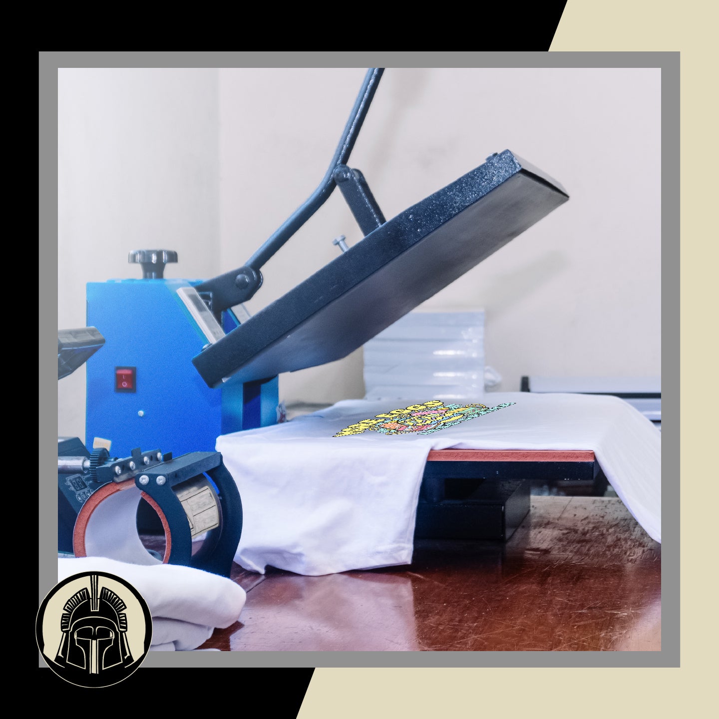 Large industrial heat press on a wooden table with a white t-shirt